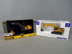 Ertl, Universal Hobbies - Two boxed diecast 1:50 scale construction vehicles,