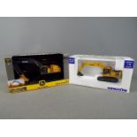Ertl, Universal Hobbies - Two boxed diecast 1:50 scale construction vehicles,