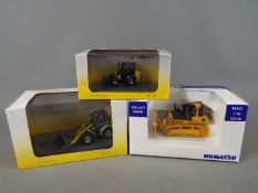 Universal Hobbies - Three boxed diecast construction vehicles in 1:50 scale from Universal Hobbies.