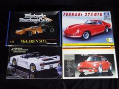 Four boxed 1:24 scale model kits of sports / racing cars to include Fujimi Porsche 911 Carrera '85