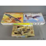 A selection of unassembled kits including Hobby Boss,