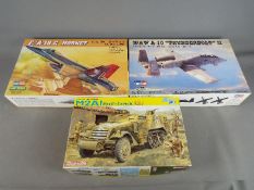 A selection of unassembled kits including Hobby Boss,