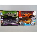 Maisto - four diecast 1:24 scale models, McLaren Spider, Dom's Plymouth Road Runner,