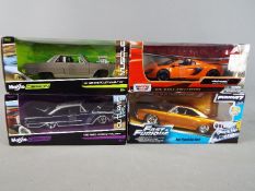 Maisto - four diecast 1:24 scale models, McLaren Spider, Dom's Plymouth Road Runner,