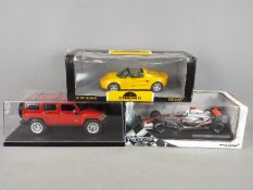 Hot Wheels, Chrono - three boxed 1:18 scale model cars.