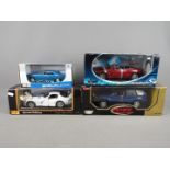 Maisto, Motor Max, Solido - Four boxed diecast vehicles in 1:18 and 1:24 scale.