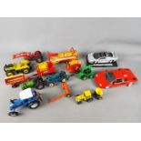 Lot to include a quantity of unboxed, playworn model farm vehicles / implements by Britains,