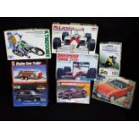 AMT, Tamiya, Hasegawa - Eight boxed plastic model vehicles kits in various scales.