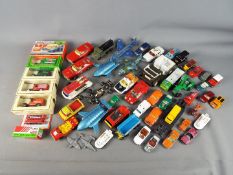 A collection of unboxed, playworn diecast model vehicles to include Dinky, Matchbox, Corgi,