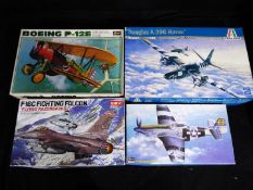 Four boxed model kits of aeroplanes in 1:32 and 1:48 scale to include Hasegawa P-51D Mustang and