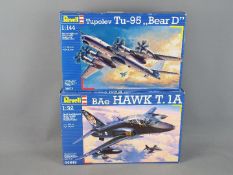 Revell -Two boxed plastic model kits by Revell in various scales.