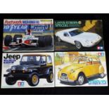 Footwork, Tamiya - Four boxed plastic model vehicle kits in various scales.