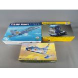Three boxed model kits comprising a 1:48 scale Hobby Boss F/A-18D Hornet,