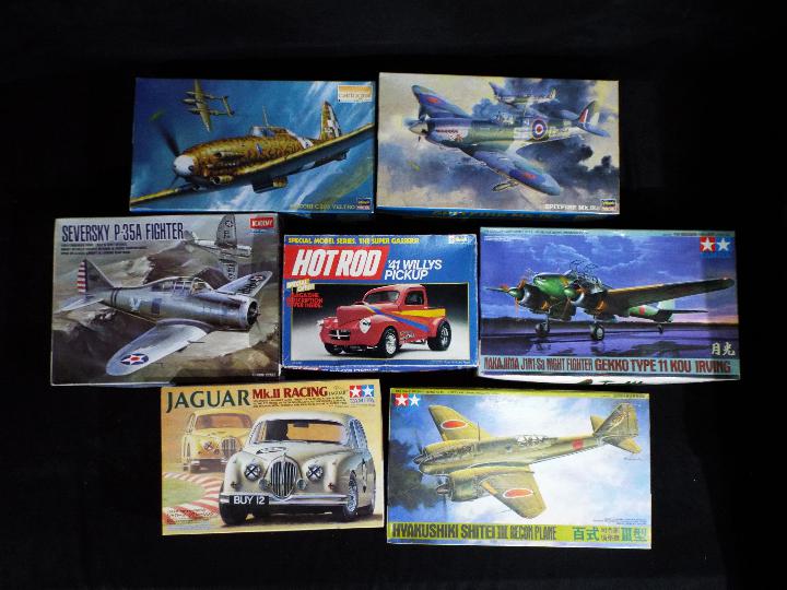 Tamiya, Academy, Revell, Hasegawa - Seven boxed plastic model kits in various scales.