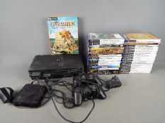 A Playstation 2 games console and a quantity of games and a small quantity of PC games.