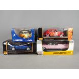 Revell, Maisto - Four boxed diecast vehicles in 1:18 and 1:24 scale.