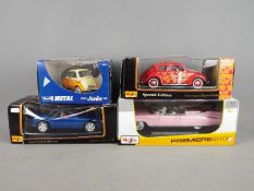 Revell, Maisto - Four boxed diecast vehicles in 1:18 and 1:24 scale.