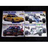 Tamiya - Four boxed 1:20 and 1:24 scale midel kits of racing cars comprising Brabham BT50 BMW Turbo,