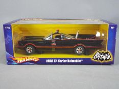 Hot Wheels - A boxed 1:18 scale diecast model of the 'Batmobile' by Hot Wheels.