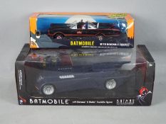 NJ Croce, DCComics - Two 1:24 boxed models of the 'Batmobile' from different eras.