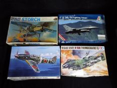 Tamiya, Hasegawa, Italeri - Four boxed plastic model aircraft kis in various scales.