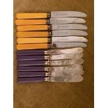 2 SETS OF 6 1930s BUTTER KNIVES YELLOW & MAUVE HANDLES