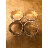 SET OF 4 WHITE METAL NAPKIN RINGS