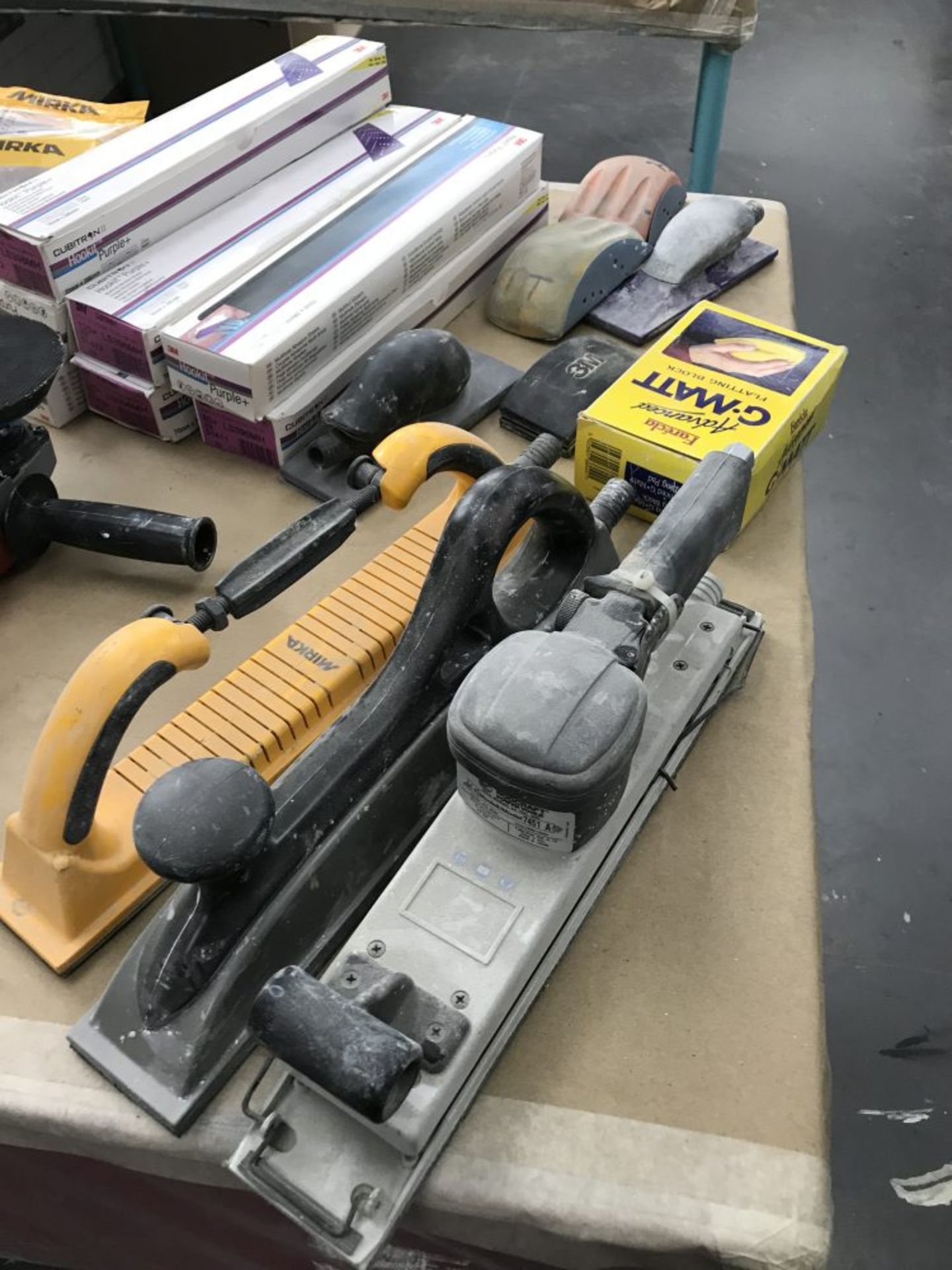 Sanding tools and abrasives