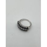 Stone Set Silver ring having two rows of shinning jet black stones to the center. total of 22