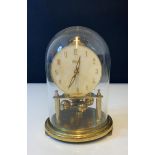 Rotating pendulum Brass 8 day clock, slightly tarnished