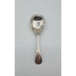 Antique silver caddy spoon with rectangular piercings to edge of bowl. clear hallmark showing Levi &