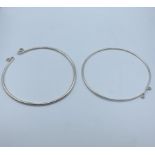 Pair of silver bangle necklace , total weight 82g and 13.5cm diameter.