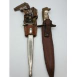 2 military daggers unknown origins, one with hangers