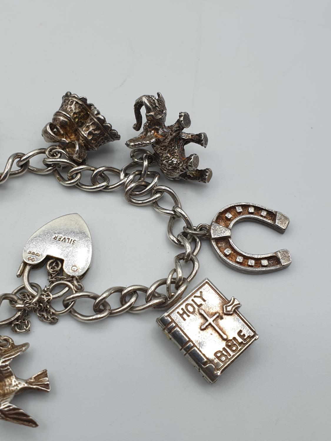 Silver charm bracelet with 8 charms and heart clasp, weight 35.6g - Image 3 of 3