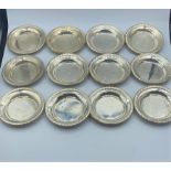 Selection of 12 silver under cups (coasters) , total weight 222g approx