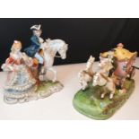 2 China figures, one of a stagecoach and the other mounted gentlemen and his lady