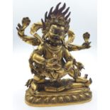 A very early gilded bronze figure of an Oriental dragon god, 20cm tall