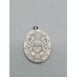 Solid silver oval pendant engraved with royal crest hallmark to rim showing London 1981 Prince