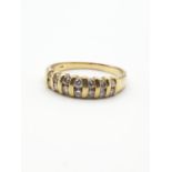 Diamond ring consisting of 2 rows of seven diamonds set in 18ct gold,ring size Q.