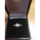 18ct yellow and white gold diamond ring, having a full one third carat solitaire to centre in a