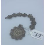 Filigree silver bracelet with matching pendant, 5cm in diameter and the bracelet is 19cm long,