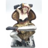 Seated erotica can-can dancer on marble base, 20cm high, base 12.5x11cm
