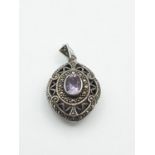 Vintage Silver locket with large amethyst stone and marquesite surround to front.