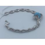 Silver bracelet with a turquoise stone and CZ small decorative stones, weight 18g and 19cm long