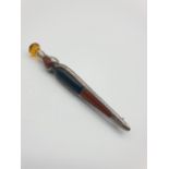 Vintage large silver Kilt pin in the shape of a dirk having Oxblood & Agate stones to front .Clear