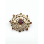 9ct gold Edwardian style brooch,gold filigree work having a large garnet centre stone with a seed