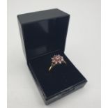 Stone set 18ct gold ring with diamonds and rubies. The mount has an eight pointed star setting