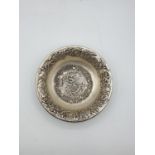 A Chinese silver (2% silver content) ornate engraved dish, with the weight of 847g. Early 20th