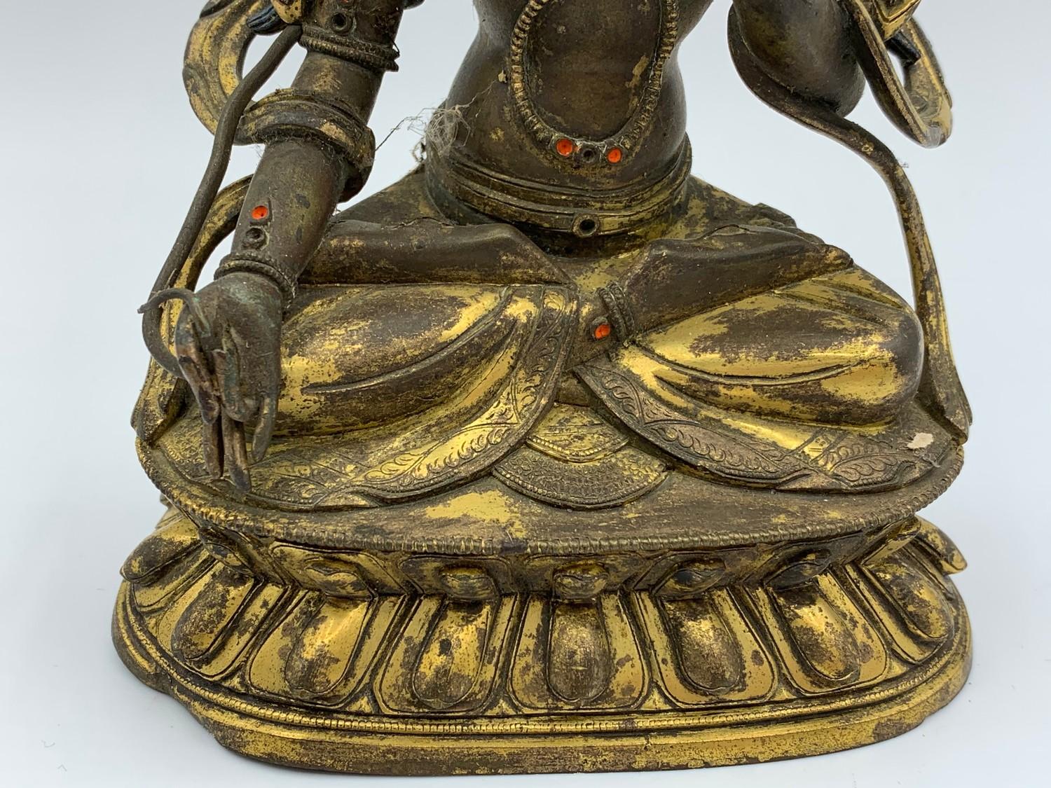 A very early Tibetan religious deity gilt on bronze with turquoise stones and painted dace, weight - Image 6 of 14