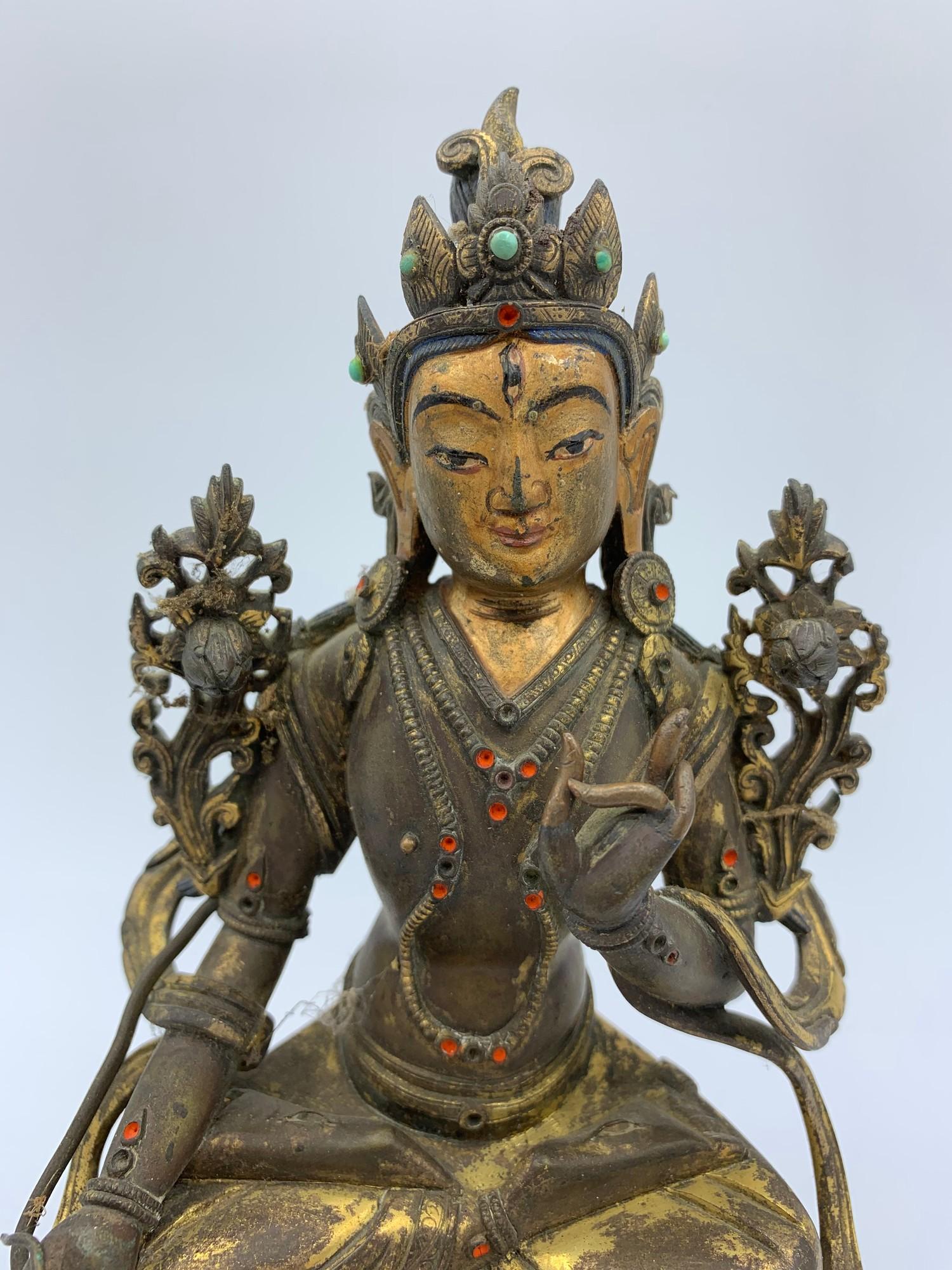 A very early Tibetan religious deity gilt on bronze with turquoise stones and painted dace, weight - Image 2 of 14